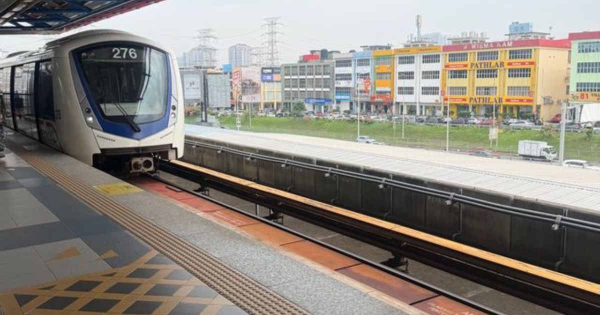 Modern LRT train arriving at a station platform near LRT buses lost property terminal.
