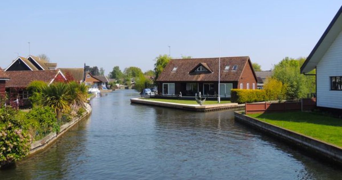 Estate agent showing a property to clients in Wembley, London