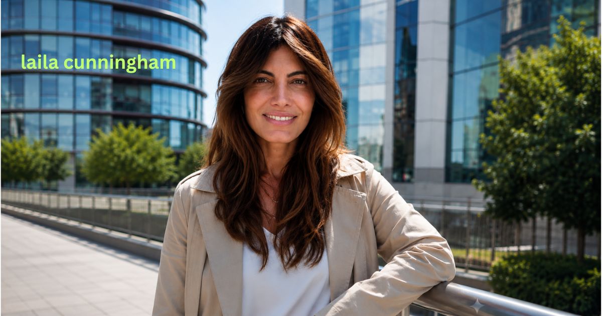 Laila Cunningham smiling outdoors in front of modern corporate buildings