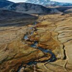 Two tectonic geo plates colliding to form volcanic mountains