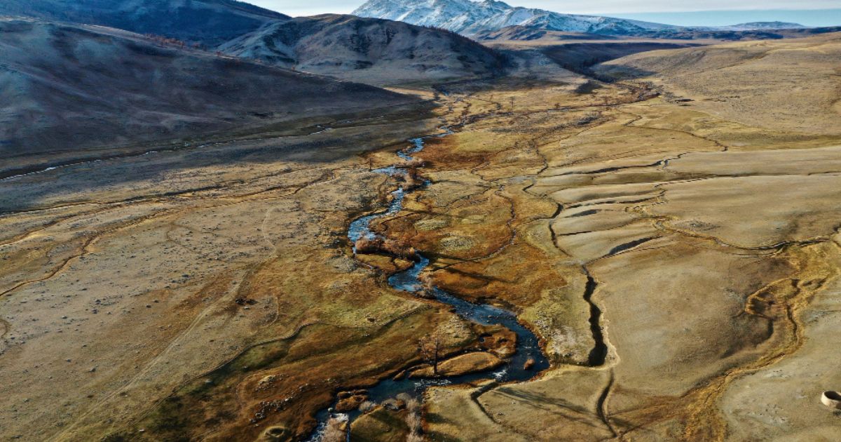 Two tectonic geo plates colliding to form volcanic mountains