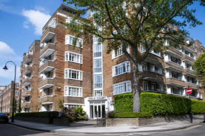 Oslo Court building with brick apartments, balconies and landscaped entrance