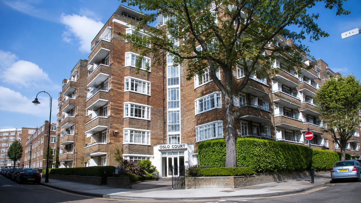 Oslo Court building with brick apartments, balconies and landscaped entrance