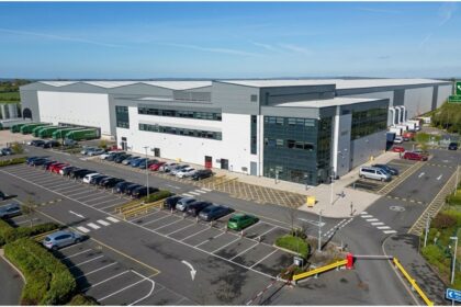Aerial view of a large commercial logistics building and car park at Fradley Park, Staffordshire.